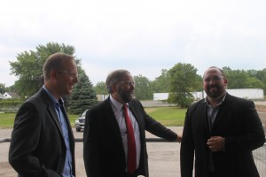 Federal NDP Leader Tom Mulcair (center) with Federal NDP candidate of record Marc Laferriere (right) and Hartmann North America president Torben Rosenkrantz- Theil (left) viewing the new factory wing currently under construction. Photo by Cody Groat.