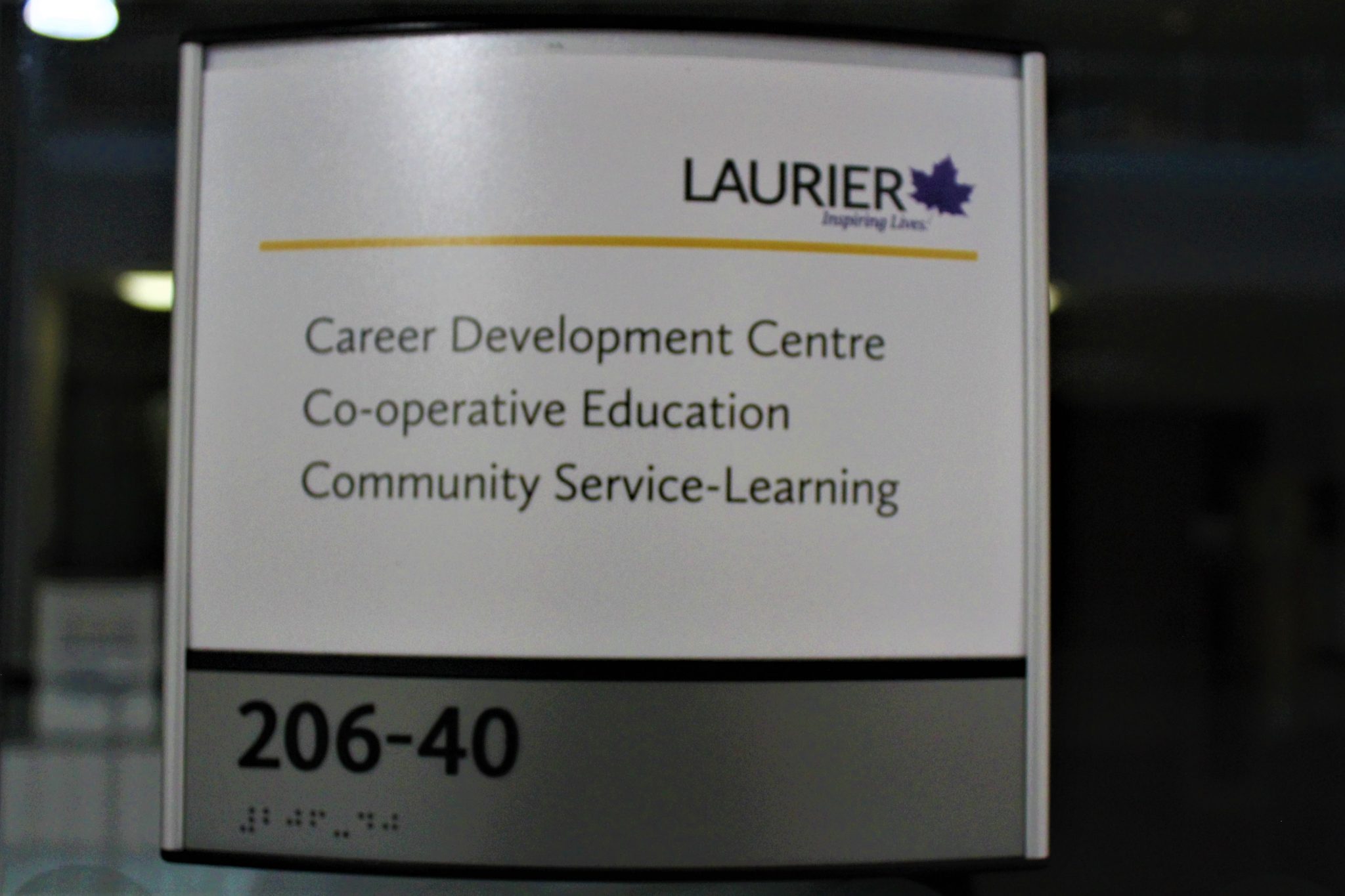 A Laurier door plaque reading "Career Development Centre, Co-operative Education, Community Service Learning.:
