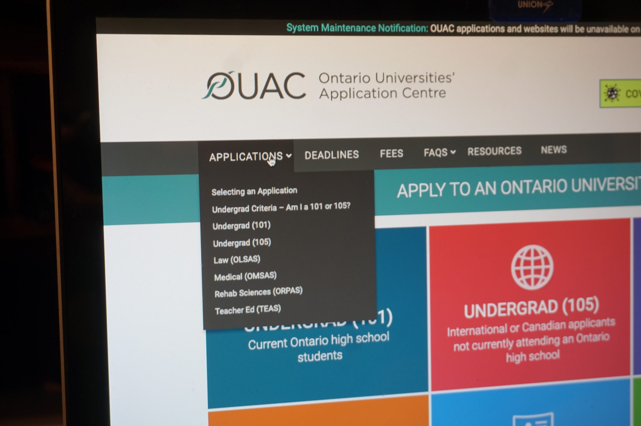 The Ontario University Application Centre home page on a laptop with the curser on the "applications" tab